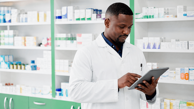 Pharmacist updating medicine availability